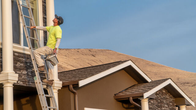 Two-story exterior fascia board painting